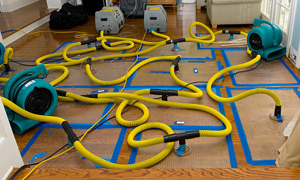Professional Flood Damage Restoration technician working in Bessemer, PA